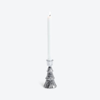 a white candle with a lit candle