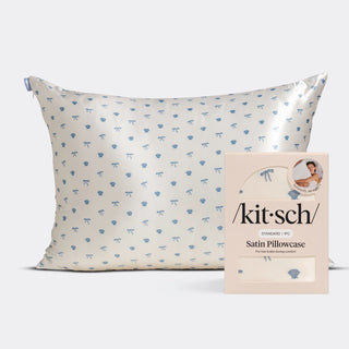 a white pillow with blue design