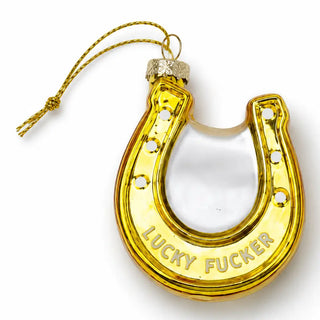 a gold horseshoe shaped ornament