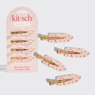 a group of plastic hair clips in a package