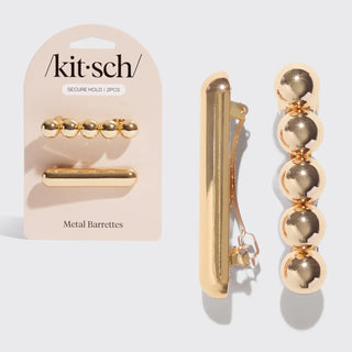 a gold hair clip and barrette