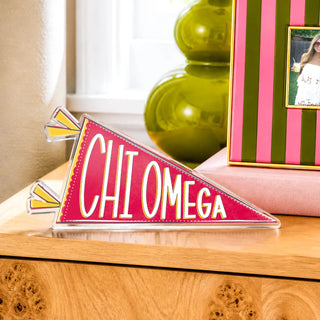 a pink sign on a dresser