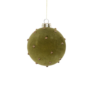 a green and gold christmas ornament