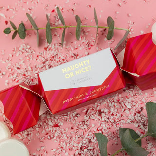 a box of candy next to a sprinkle of sugar