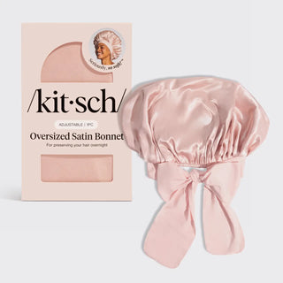 a pink bonnet with a bow in it