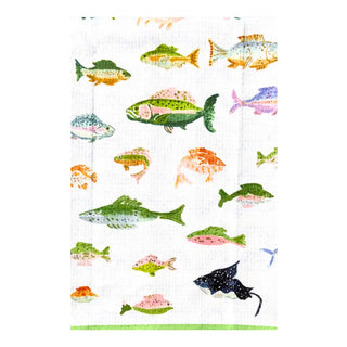 a group of fish on a white surface