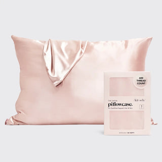 a pink pillow with a white box
