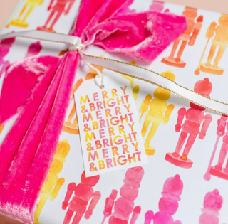 a gift box with a ribbon and a tag