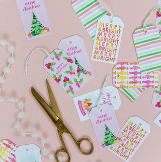 a group of gift tags and scissors