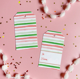 two tags on a pink surface