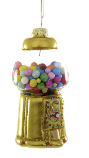 a gold bubble gum machine with colorful balls inside