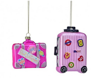 a couple of pink luggage ornaments
