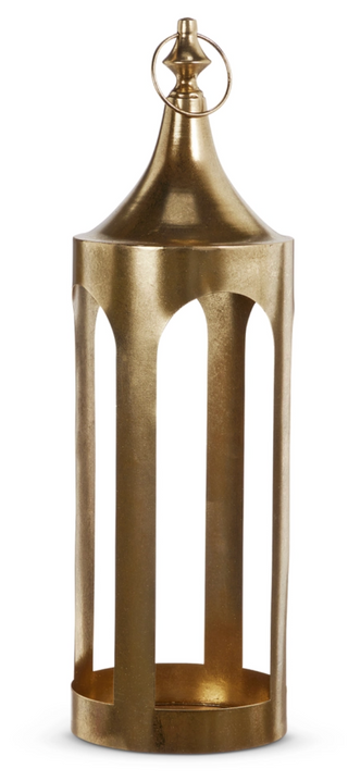 a gold metal object with a round top