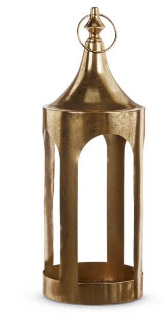 a gold metal object with a pointed top
