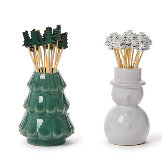 a couple of ceramic objects with trees in them