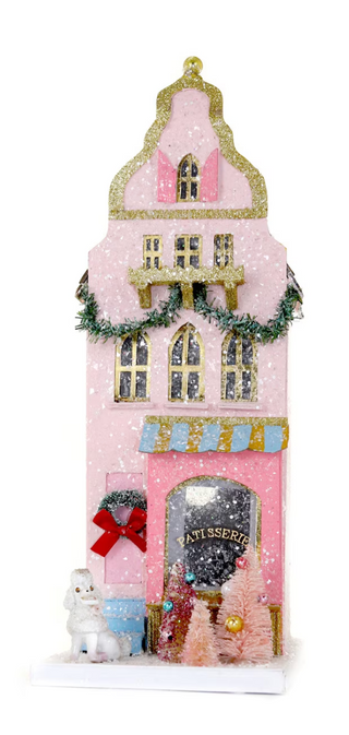 a pink house with gold trim