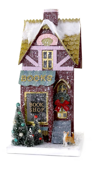 a toy house with snow on it