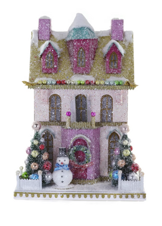 a small house with a snowman