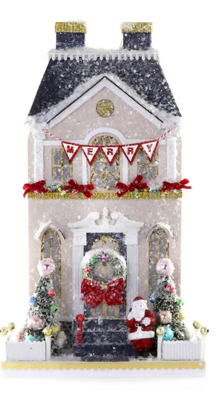 a house with a wreath and trees