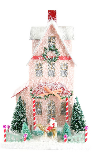 a pink house with snow on it