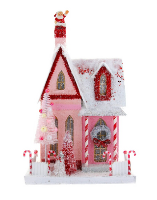 a pink and white house with candy canes