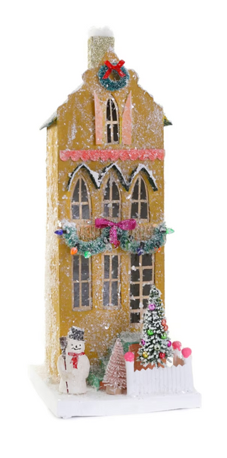 a house with a tree and decorations