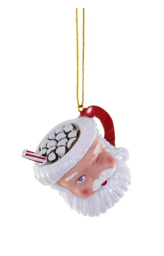 a santa claus mug with candy