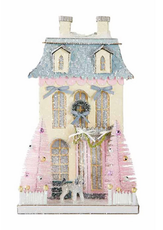a toy house with a white fence and pink trees