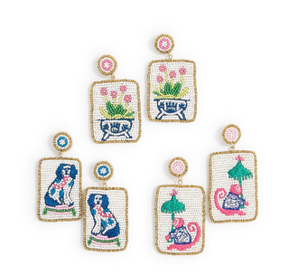 a group of earrings with pictures of animals