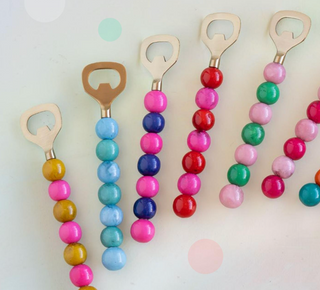 a group of colorful beaded bottle openers