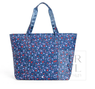a blue floral bag with a handle