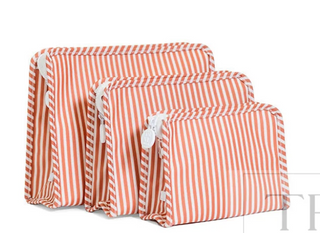 a group of orange and white striped bags